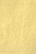 yellow crumpled squared piece of paper