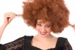 Teenage beauty having wig-fun