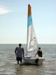 father and son with sailboat