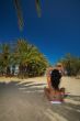Bikini between palms
