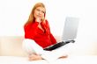 Women with laptop on couch