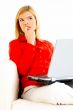 Women with laptop on couch