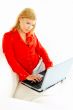 Women with laptop on couch