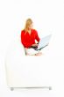Women with laptop on couch