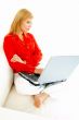 Women with laptop on couch