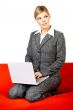Woman on red couch