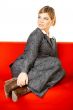 Woman on red couch