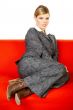 Woman on red couch