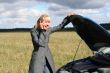 young woman with her broken car