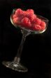 Glass bowl with raspberries