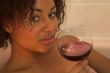 Enjoying a glass of wine in the bathroom