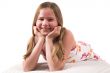 Pretty blond girl lying on a couch
