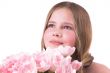 Beautiful little girl with pink tulips