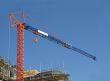 Orange and blue crane on construction site