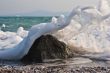 Sea wave gushing over the rock