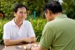 Smiling Man Playing Chess
