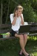 Businesswoman in the park; shock