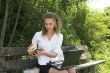 Businesswoman in the park; healthy lunch