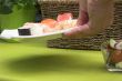 Putting down the sushi plate