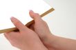 hands holding hollow book