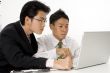 Men Working On Computer