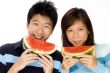 Couple Eating Melon