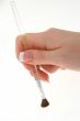 female hand with paintbrush