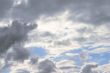massive stormy clouds against bright blue sky