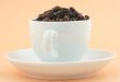 cup of full of coffee beans