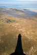 lighthouse shadow in landscape