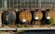 A row of four oil storage tanks