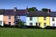 row of village houses painted in pastel colours