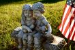 children and puppy statue