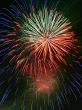 Night celebration fireworks upon dark sky