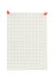 piece of squared paper thumbthacked to white wall