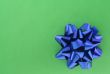 blue bow on green background