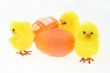 three toy chickens with decorated eggs