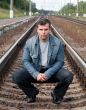 man against tracks