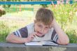 boy writes to writing-books