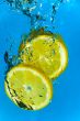 Lemon Fruit Splashing into Citrus Water