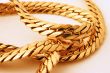 gold chain details on white
