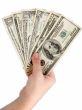 Female hand with dollars