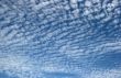 Panorama of blue white cloudy sky wide angle view