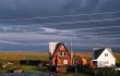 Country cottage at a dawn with a line of external wires