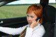 Red-haired woman with mobile-phone