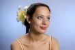 The beautiful girl with a lily in hair