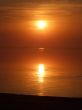 Orange sunset above a quiet serene gulf