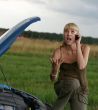 young woman with her broken car