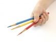 hand with pencils