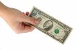hand with ten dollars